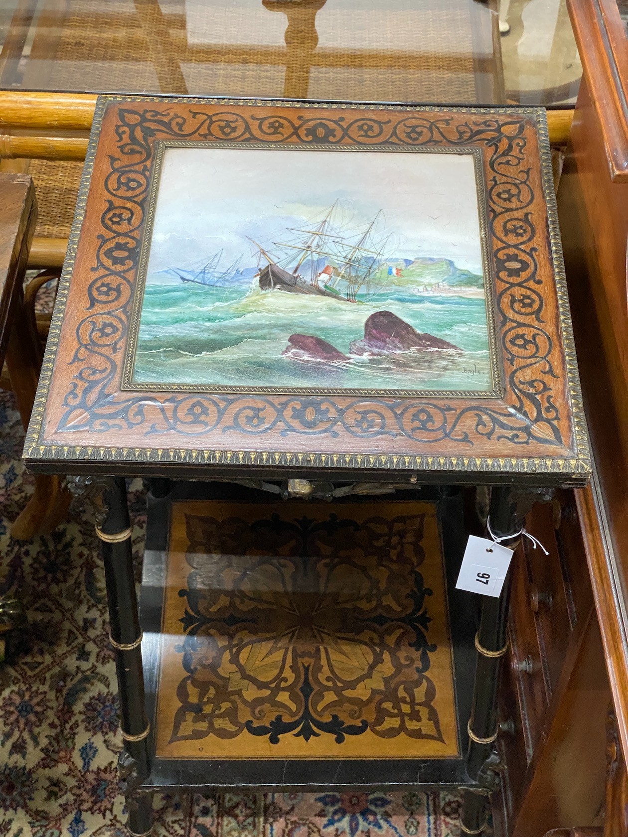 A 19th century French marquetry inlaid tiled top occasional table, painted with a storm shipping scene, signed 'Bayle', width 38cm, depth 38cm, height 78cm